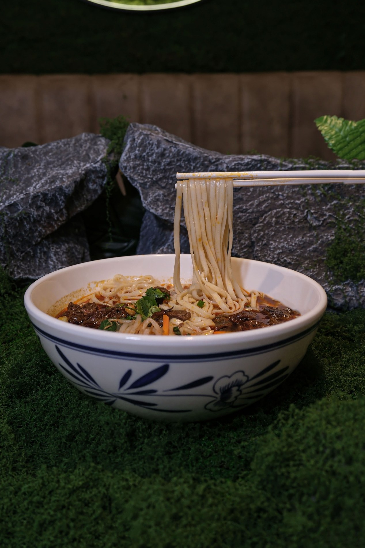Gulu Gulu Lamian noodles lifted with chopsticks